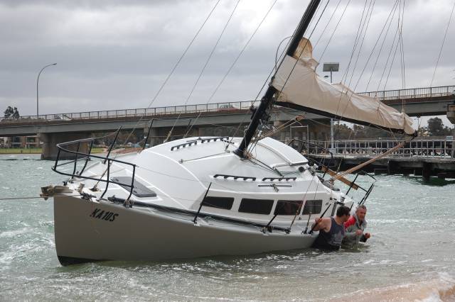 Strong winds drag yacht