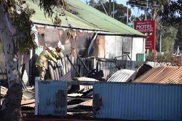 Motel evacuated as neighbouring house burns to the ground