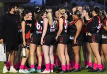 Pink socks during footy for Breast Cancer Awareness
